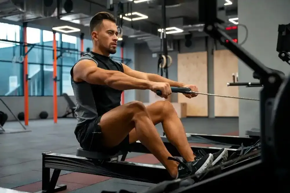 A person performing a seated row